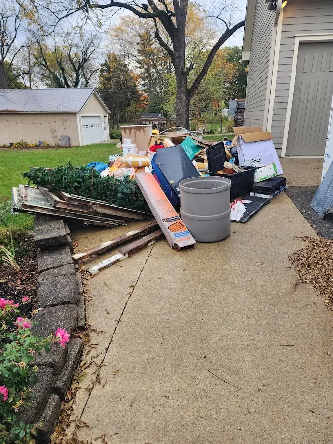Dumpster being loaded with debris for Estate Cleanout Dumpster Rental in Almira